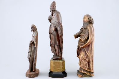 A lot of 4 carved wood figures of saints, 16/18th C.