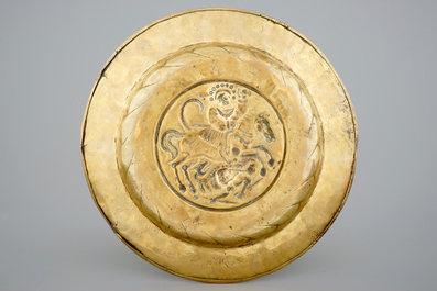A Nuremberg brass alms dish depicting Saint-George fighting the dragon, 16th C.