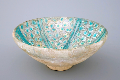 A Kashan relief moulded turquoise glazed bowl, Iran, 16/17th C.