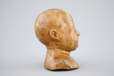A carved fruitwood child's head, 17/18th C.
