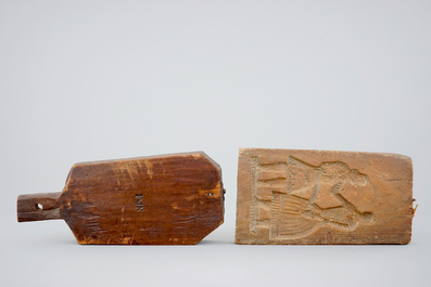 Various wood objects: a lion of Bruges, a butter mold, a cookie mold, a school bag and a wine jug, 18/20th C.