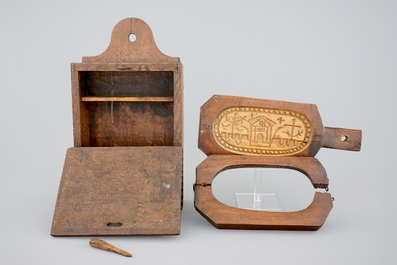 Various wood objects: a lion of Bruges, a butter mold, a cookie mold, a school bag and a wine jug, 18/20th C.