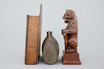 Various wood objects: a lion of Bruges, a butter mold, a cookie mold, a school bag and a wine jug, 18/20th C.