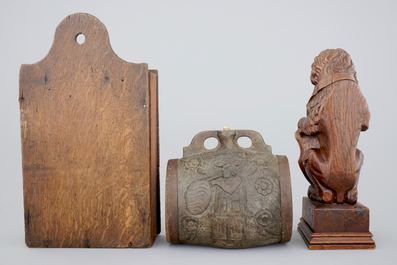 Various wood objects: a lion of Bruges, a butter mold, a cookie mold, a school bag and a wine jug, 18/20th C.