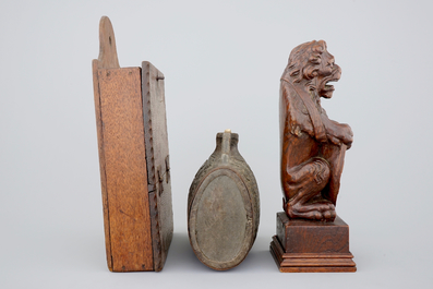 Various wood objects: a lion of Bruges, a butter mold, a cookie mold, a school bag and a wine jug, 18/20th C.