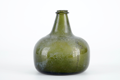 A Dutch green glass wine bottle, 17th C.