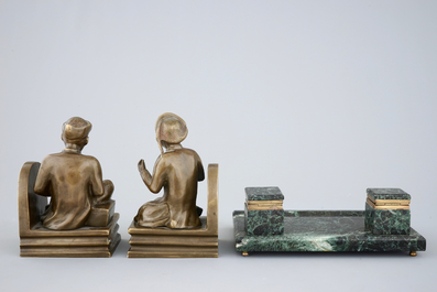 An art deco green marble inkwell and a pair of figurative book ends, 20th C.