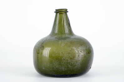 A Dutch green glass wine bottle, 17th C.