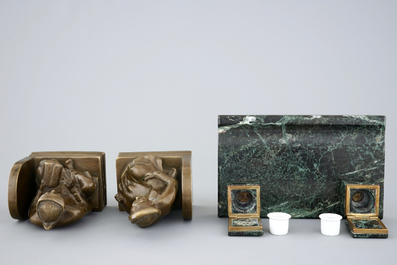 An art deco green marble inkwell and a pair of figurative book ends, 20th C.