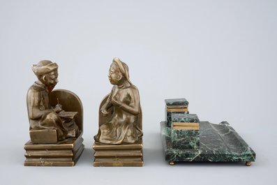 An art deco green marble inkwell and a pair of figurative book ends, 20th C.