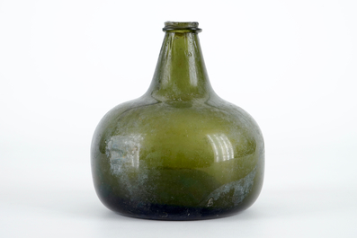 A Dutch green glass wine bottle, 17th C.