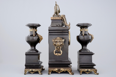 A three-piece gilt bronze and black marble chinoiserie garniture, 19th C.