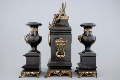 A three-piece gilt bronze and black marble chinoiserie garniture, 19th C.
