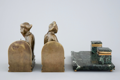 An art deco green marble inkwell and a pair of figurative book ends, 20th C.