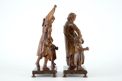 Deux groupes en bois sculpt&eacute; au sujets de Joseph et l'archange Michael, avec enfant, sur base, 18&egrave;me