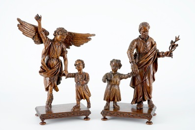 A pair of wood figures of the archangel Michael and Joseph, both with child, on base, 18th C.
