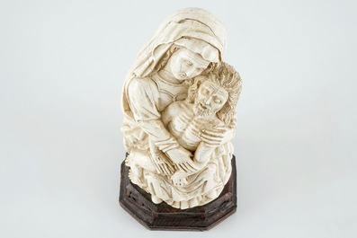 A gothic revival carved ivory Piet&agrave; group, prob. Dieppe, 19th C.