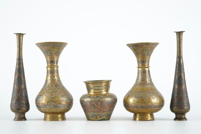 Two pairs of Cairoware brass vases and a smaller one, Egypte, 19th C.