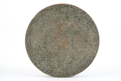 A round engraved tinned brass mirror box, Central Persia, 18/19th C.