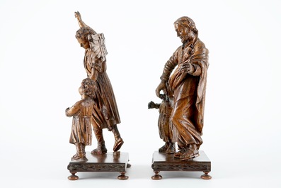 Deux groupes en bois sculpt&eacute; au sujets de Joseph et l'archange Michael, avec enfant, sur base, 18&egrave;me