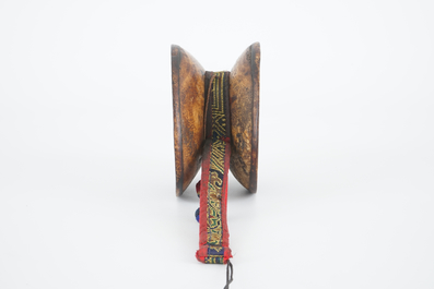 A Tibetan human skull drum, damaru, in original case, Tibet, 18/19th C.