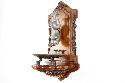 A pewter wall fountain and basin on a carved wood stand, 18/19th C.