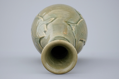 A Chinese dark celadon glazed vase with fish, 19/20th C.