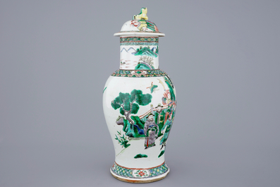 A Chinese famille verte vase and cover with a court scene, 19th C.
