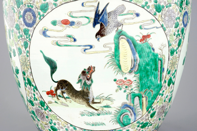 A large Chinese famille verte fish bowl with mythological animals, 19th C.