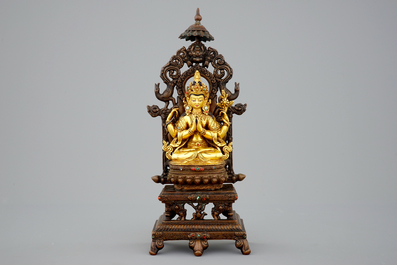 A Sino-Tibetan gilt bronze figure of Shadakshari Lokeshvara on a throne, 19/20th C.