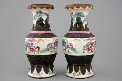 A mirrored pair of Chinese famille rose Nanking vases, 19th C.