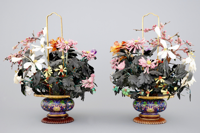 A mirror pair of large jade and precious stone trees in cloisonne vases, early 20th C.