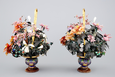 A mirror pair of large jade and precious stone trees in cloisonne vases, early 20th C.