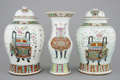 A set of three Chinese famille rose vases, 19th C.