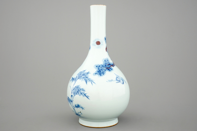 A Chinese blue and underglaze red bottle vase with cranes, 19/20th C.
