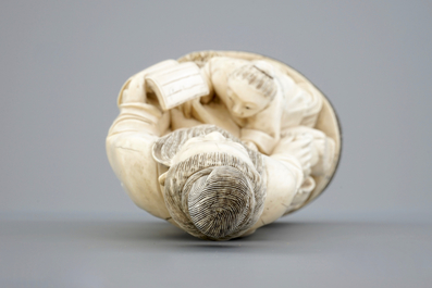 A Chinese carved ivory group of a sage with a child, 19th C.