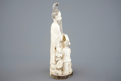 A Chinese carved ivory group of a sage with a child, 19th C.