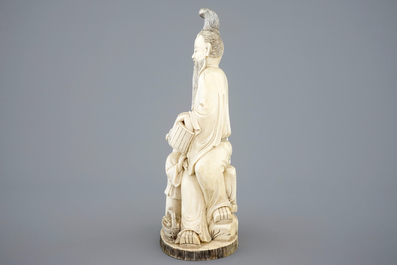 A Chinese carved ivory group of a sage with a child, 19th C.