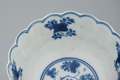 Three Chinese blue and white plates and a lotus shaped cup and saucer, Kangxi