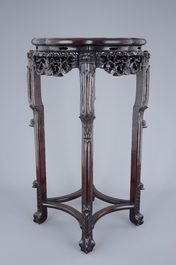 A tall Chinese carved wood stand with marble inset, 19th C.
