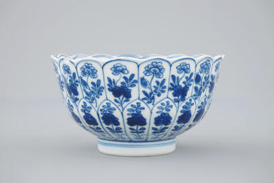 Three Chinese blue and white plates and a lotus shaped cup and saucer, Kangxi