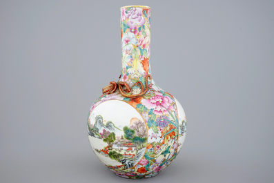A Chinese famille rose millefleurs bottle vase with an applied dragon and landscape panels, 19/20th C.