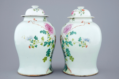 A pair of Chinese famille rose quail vases with covers, 19th C.