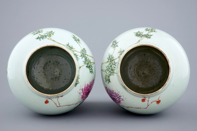 A pair of Chinese famille rose quail vases with covers, 19th C.
