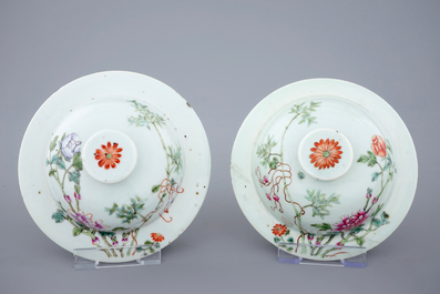 A pair of Chinese famille rose quail vases with covers, 19th C.