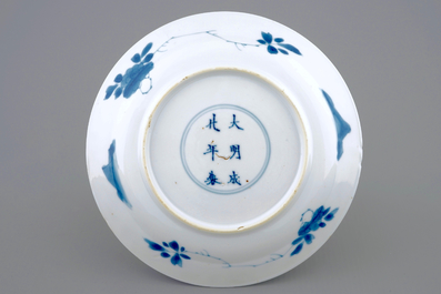 A Chinese blue and white &quot;Adam and Eve&quot; saucer dish, Kangxi