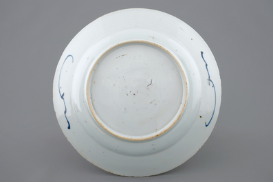 A Chinese blue and white plate after a Dutch Delft example, Qianlong, 18th C.