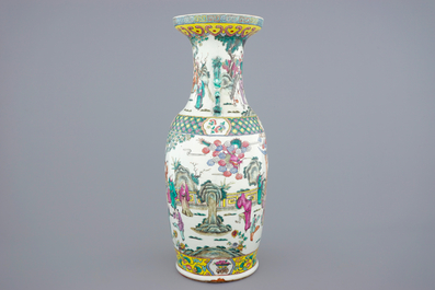 A tall Chinese famille rose vase with a garden scene, 19th C.