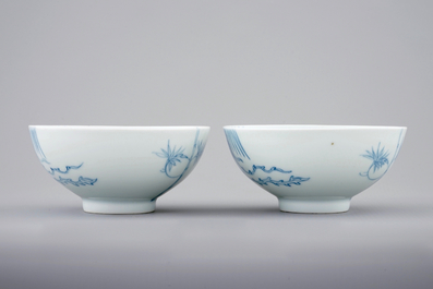 A pair of Chinese blue and white &quot;phoenix over the wall&quot; bowls, Yongzheng mark and poss. of the period