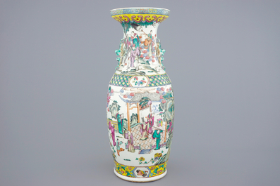 A tall Chinese famille rose vase with a garden scene, 19th C.